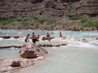 People playing in the mud pool in the Little Colorado River.